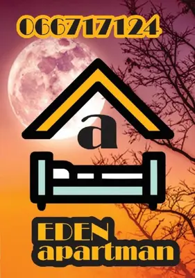 a sign that reads eaten amazon with a house with the moon at Apartman EDEN No 1 in Teslić