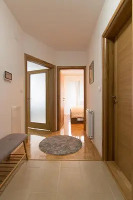 a hallway with a door leading to a bedroom at Apartman Carica in Visoko