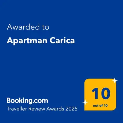a yellow sign with the text awarded to apartmentarianaria at Apartman Carica in Visoko