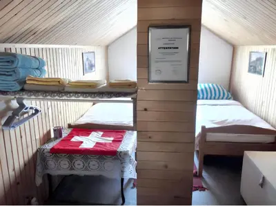 a small room with two bunk beds and a table at Cozy House in Jazvine with Garden in Jazvine