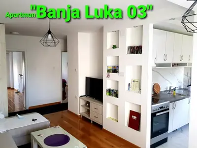 a living room with white cabinets and a tv at Banja Luka 03 in Banja Luka