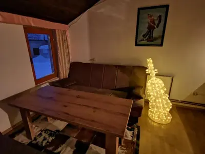 a living room with a couch and a coffee table at Winter Forest Vlasic in Travnik