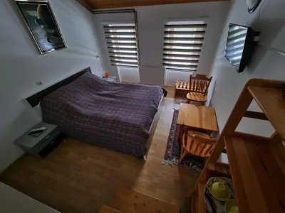 an overhead view of a bedroom with a bed and a table at Winter Forest Vlasic in Travnik
