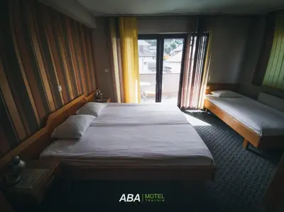 a bedroom with two beds and a window at Garni Motel Aba in Travnik