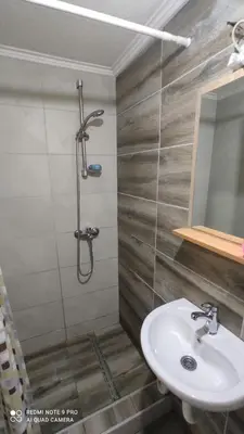 a bathroom with a sink and a shower at Vlašić vikendica BHL in Šišava