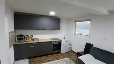 a kitchen with a sink and a counter top at Vlašić vikendica BHL in Šišava