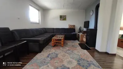a living room with a couch and a coffee table at Vlašić vikendica BHL in Šišava