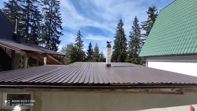 a roof of a house with a thermometer on it at Vlašić vikendica BHL in Šišava