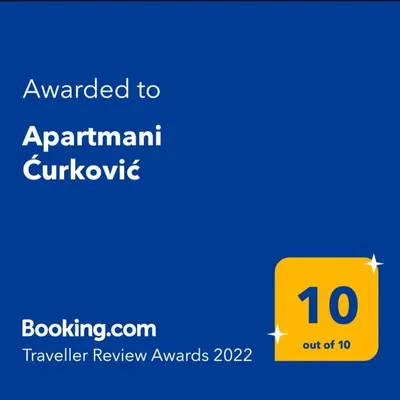 a yellow sign with the text awarded to apartment quarantine at Apartmani Ćurković in Kupres