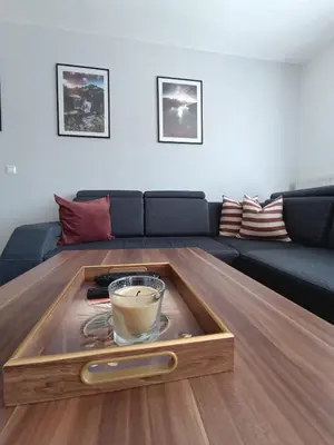 a coffee table with a cup of coffee on top of it at DreamHouse in Jajce