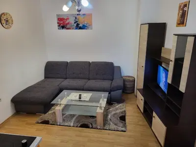 a living room with a couch and a coffee table at Stan na dan Prnjavor, Gajba u centru in Prnjavor