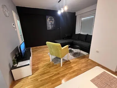 a living room with a couch and a chair at CITY in Banja Luka