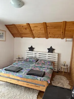 a bedroom with a bed with stars on the wall at -Moon- in Kupres
