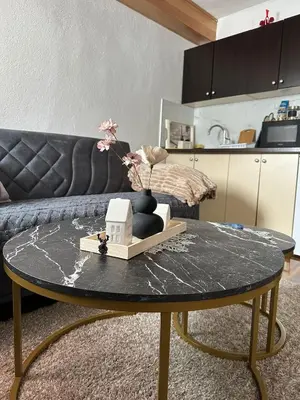 a coffee table in a living room with a couch at -Moon- in Kupres
