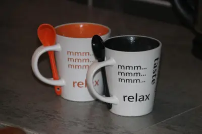 two coffee mugs sitting next to each other on a table at Vlasic holiday home in Vlasic