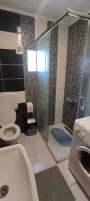 a bathroom with a shower with a toilet and a sink at Vlasic holiday home in Vlasic