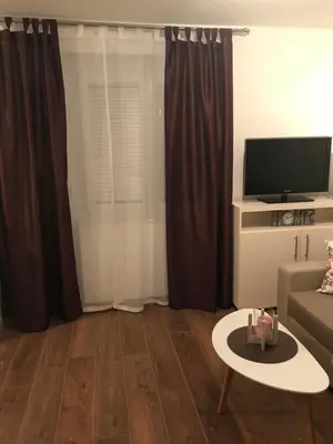 a living room with a couch and a tv at Sarah in Kupres