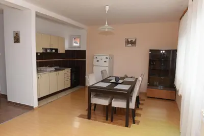 a kitchen and dining room with a table and chairs at Bingo Apartments in Banja Luka