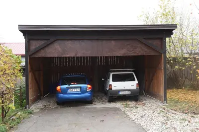 two cars are parked in a garage at Bingo Apartments in Banja Luka