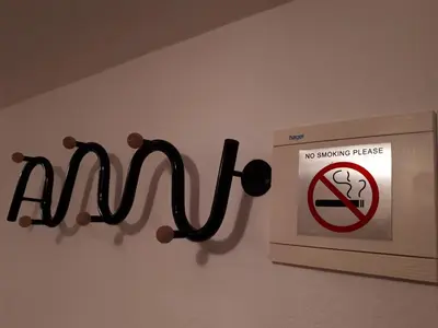 a sign that says no smoking please on a wall at Apartman Ivana in Jajce