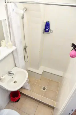 a bathroom with a shower and a sink at Apartmani Koko in Banja Luka