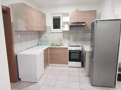 a kitchen with white appliances and a white refrigerator at DASS apartmani in Banja Luka