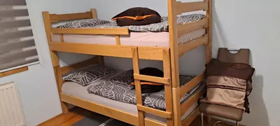 a couple of bunk beds in a room at Apartman Jonjić in Kupres