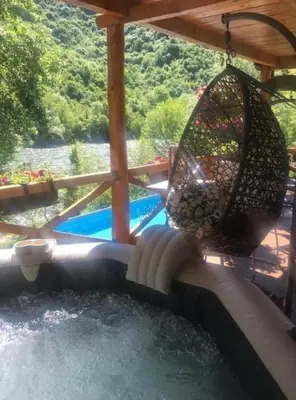 a water slide in a backyard with a swing at GOLD RIVER in Krupa na Vrbasu