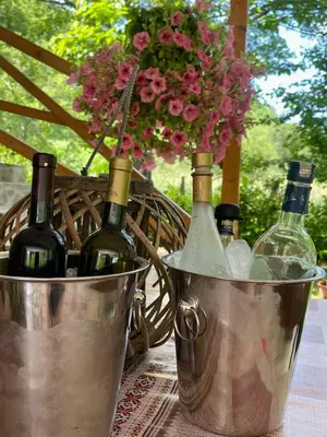 a bunch of bottles of wine in buckets on a table at GOLD RIVER in Krupa na Vrbasu