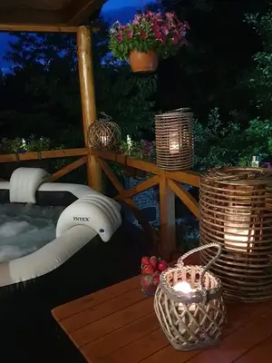 a table with baskets and candles on a deck at GOLD RIVER in Krupa na Vrbasu