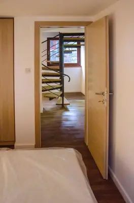 a room with a room with a door and a staircase at KUĆA NENO in Vlasic