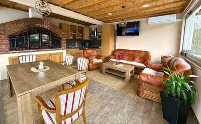 a living room with a couch and a table at Crystal Račić in Bihać