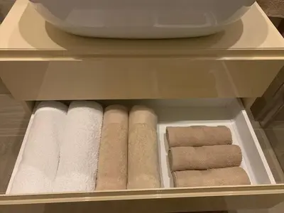 a drawer with rolls of towels and towels at City Center Apartment in Banja Luka