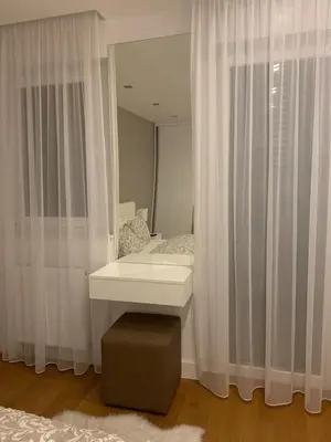 a bathroom with a sink and a mirror at City Center Apartment in Banja Luka