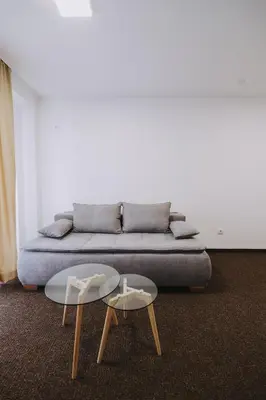 a living room with a couch and a table at Hotel Tanja in Banja Luka