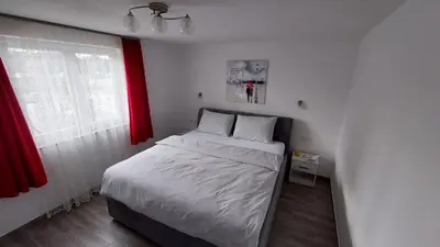 a small bedroom with a bed and a window at Aleksandar in Banja Luka