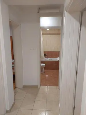 an empty bathroom with a toilet and a tub at Aleksandar in Banja Luka