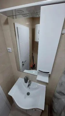 a bathroom with a white sink and a mirror at Aleksandar in Banja Luka