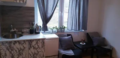 a kitchen with a counter and a sink and a window at Studio Apartman SAJRA in Kulen Vakuf