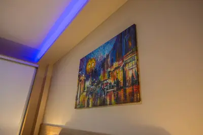 a painting hanging on a wall in a room at Gradiska na Savi apartmani i sobe in Bosanska Gradiška