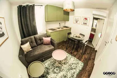 a small living room with a couch and a table at Polar Apartments Banja Luka LPIJ in Banja Luka