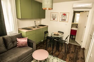 a living room with a couch and a table at Polar Apartments Banja Luka LPIJ in Banja Luka