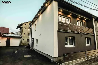 a building with a balcony on the side of it at Polar Apartments Banja Luka LPIJ in Banja Luka