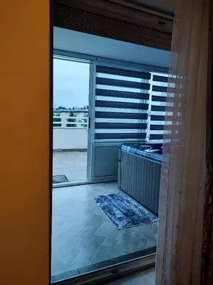 a room with a window with a view of a balcony at Spa apartman Iva in Banja Luka