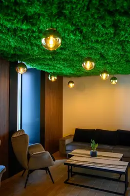 a living room with a couch and a table at Hotel Salis in Tuzla