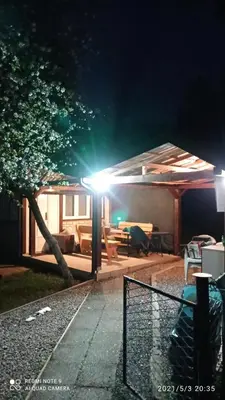 a house with a light on the roof at night at Ravne Apartman 2 in Visoko