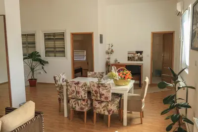 a dining room with a table and chairs at Pansion Centar in Tuzla