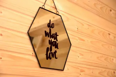 a mirror hanging on a wooden wall with the words do what you want at Cottage Lana in Jajce
