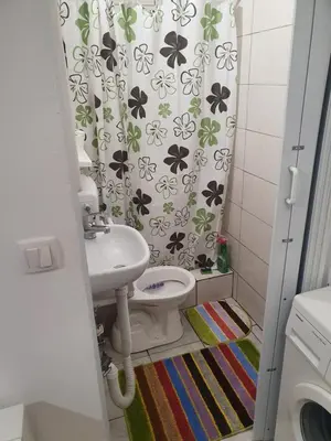 a small bathroom with a toilet and a sink at Garsonjera u centru Prnjavor in Prnjavor