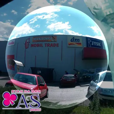 a round mirror image of a car dealership at Stan na dan AS Doboj in Doboj